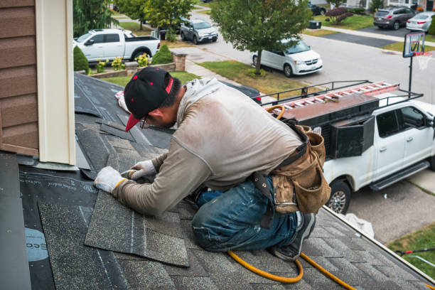 Professional Roofing technician working in Bandon, OR